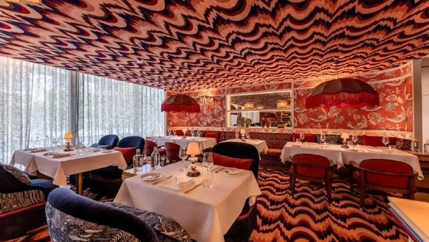 Interior of Don Alfonso 1890 restaurant on the Amalfi Coast with patterned ceiling and decor
