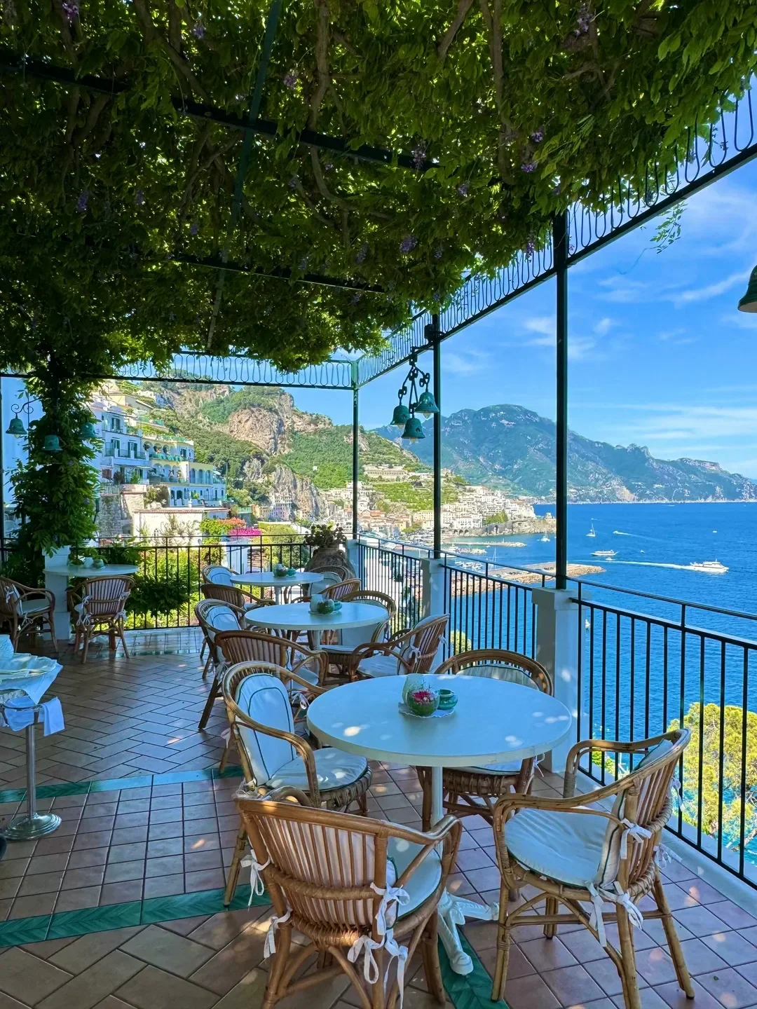 Outdoor terrace at Glicine restaurant overlooking the Amalfi Coast