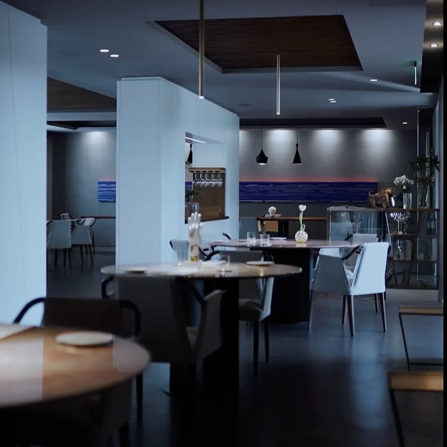 Interior of Osteria Arbustico restaurant in Amalfi Coast, featuring elegant dining tables.