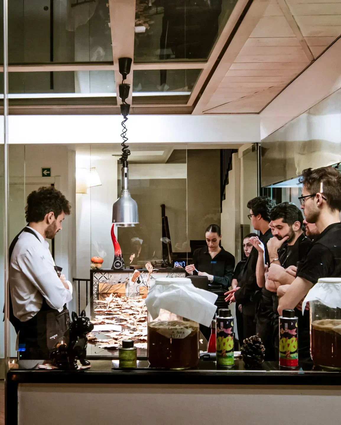 Chefs at work inside Piazzetta Milù restaurant on the Amalfi Coast, preparing dishes.