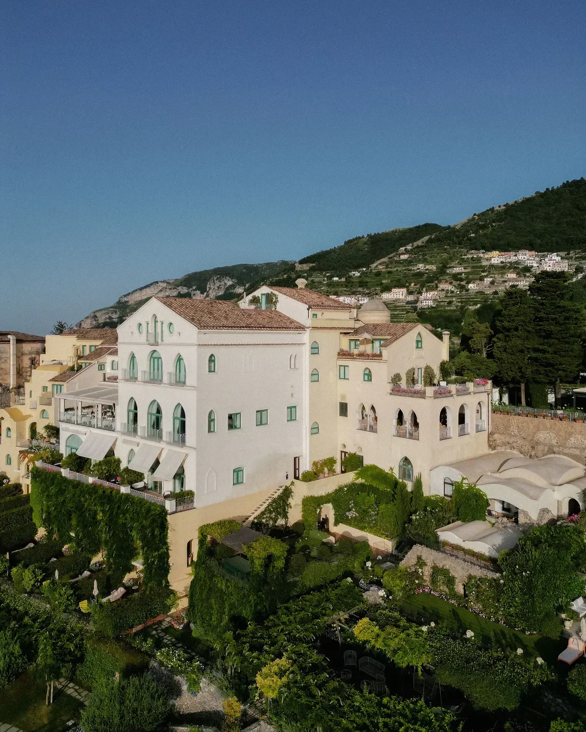 Exterior of Ristorante Belvedere on the Amalfi Coast, showcasing lush gardens and architecture