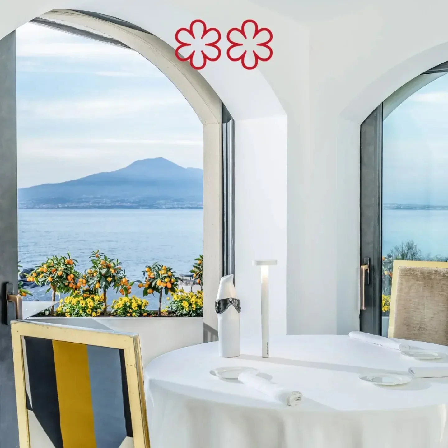 Dining at Torre del Saracino on the Amalfi Coast with a sea view and modern decor.